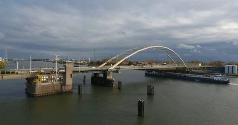 Road bridge over river and boat, Aerial view Stock Footage 101269302