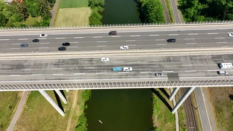 A road bridge over the water. Bridge over the river with car traffic Stock Footage 234069651