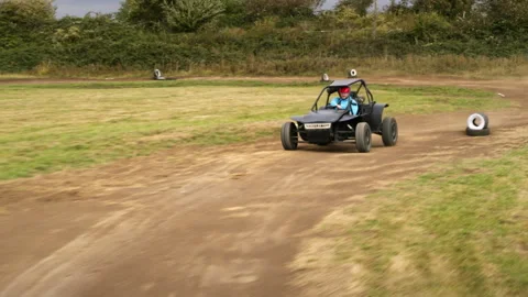 Off road buggy racing on a dirt track Video stock 336402923