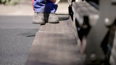 Road Builder Man Walking On A Machine's Stair Outdoors In Dungarees Stock Footage 141999300
