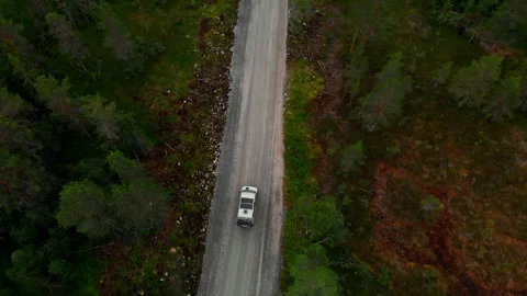 Off road camper van drive on forest gravel road Stock Footage 254705775