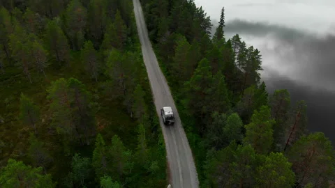 Off road camper van drive on forest gravel road Video stock 254858925