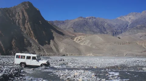 Off-road car drive over river on Annapurna region, Nepal. Stock Footage 56809775