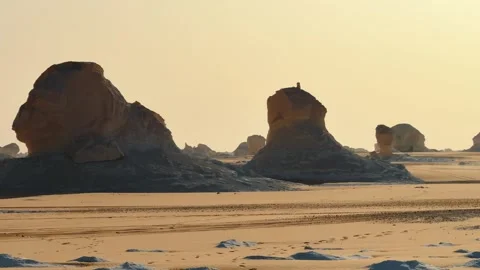 Off road car driving fast through White Desert between limestone rock formation Stock Footage 340869010