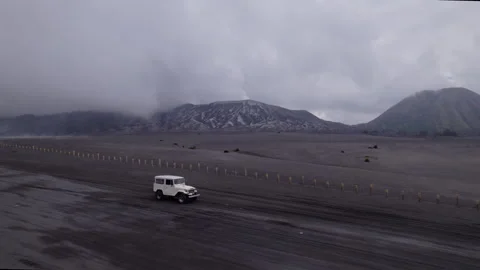 Off-road car driving through Mount Bromo lava field Stock Footage 320000677