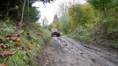 Off road car driving through a mud Stock Footage 158974679