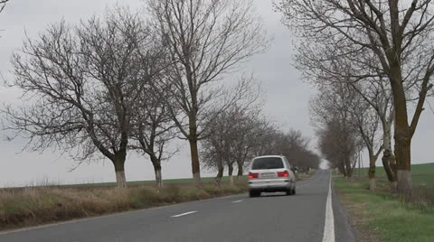 Road with car passing by Video stock 22572619