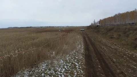Off-road car riding through the mud on the field Stock Footage 70082453