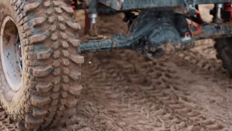 Off-road car wheels and marsh tires. Off-road and mud jeep tour and dirt road Stock Footage 270163045