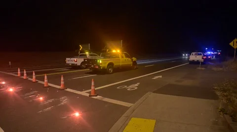 Road closed with cones flares DOT trucks reader board Stock Footage 45961679