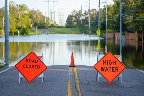 Road Closed damage after hurricane. Stop road sign. Stock Photos