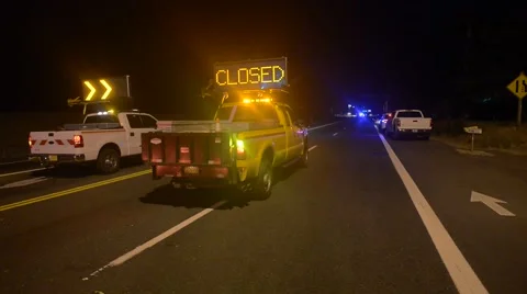 Road closed dot trucks with flashing lights  night shot. police lights Stock Footage 45961690