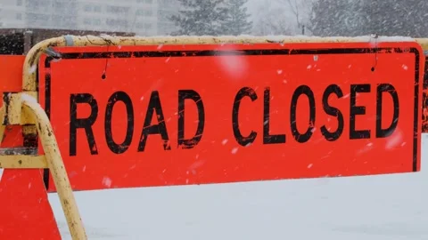 Road Closed Sign in Winter Snowfall Street Signs Video. Stock Footage 331945155