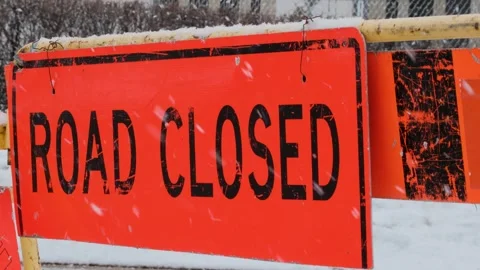 Road Closed Sign in Winter Snowfall Street Signs Video. Stock Footage 331945167