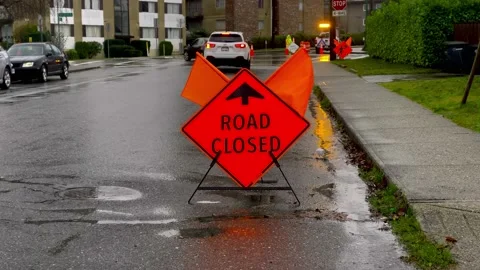 Road Closed Temporary Road Sign on a Street. 4k. Slow Motion. Stock Footage 145297749
