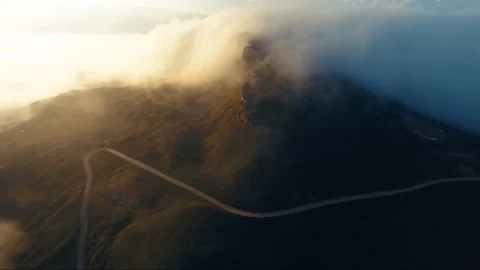 Road in the clouds on golden sunset Stock Footage 102185404