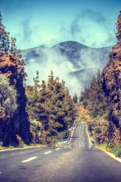 Road in the clouds in the mountains Stock Photos