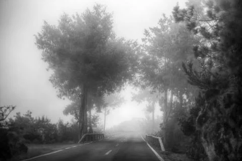 Road in the clouds in the mountains Stock Photos