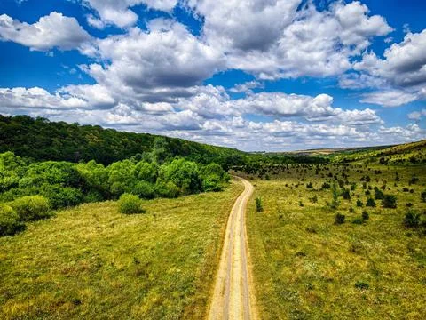 On the road with clouds Stock Photos