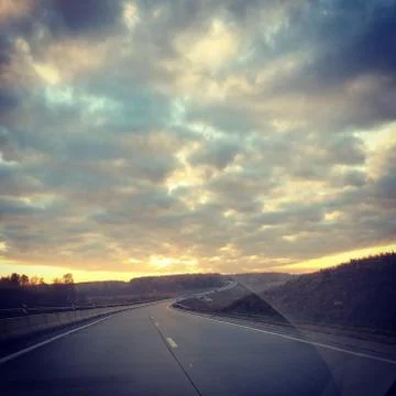 Road to the clouds view from the car window Stock Photos