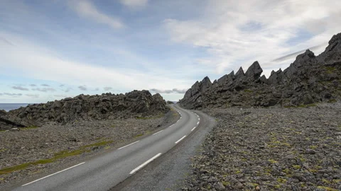 Road on the coast passing through the lunar landscape Stock Footage 250287512