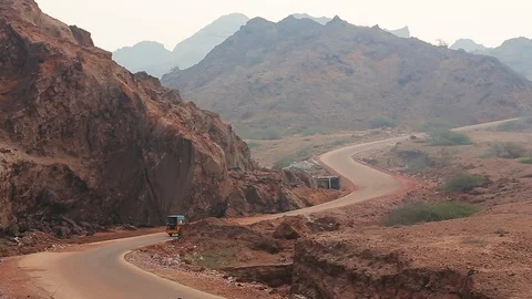 Road with the colored desert mountains of Hormuz island. Iran. Stock Footage 104858950