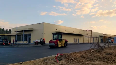 Road compactor drives on fresh asphalt Stock Footage 247769616