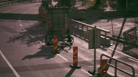 Road construction activity on a bright day with traffic barriers in place Vídeos de archivo 304468197
