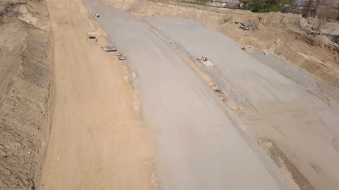Road construction. Aerial view. Construction of a bypass road near the city. Tra Stock Footage 107139647