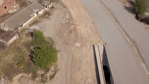 Road construction. Aerial view. Construction of a bypass road near the city. Tra Video stock 107141261