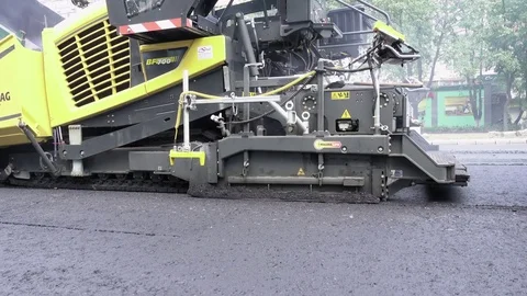 Road construction. Applying new hot asphalt. Stock Footage 82184840