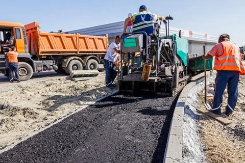 Road Construction. Asphalt spreader Stock Photos