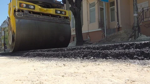 Road Construction. Compactor roller at asphalting work Stock Footage 89154749