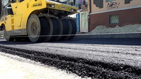 Road Construction. Compactor roller at asphalting work, close up Stock Footage 89174620