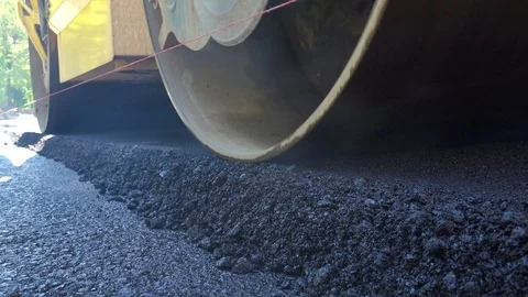 Road Construction. Compactor roller at asphalting work, close up Stock Footage