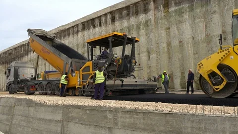 Road Construction. Compactor roller at asphalting work Stock Footage 97705786