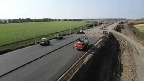 Road construction crew paving new asphalt highway. Clip Vídeos de archivo 312074309
