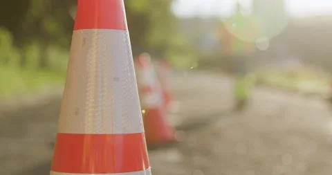 Road Construction Flagger Placing Traffic Cones Along Road Stock Footage 201282274
