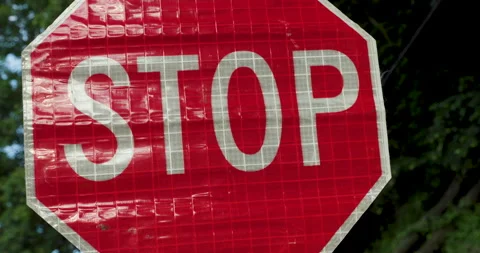 Road Construction Flagger Turning Sign from Slow to Stop While Directing Traffic Stock Footage 201282368