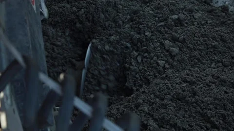 Road construction. Mixing of building materials. Crushed stone. Concrete Stock Footage 141433206