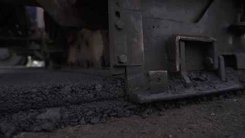 Road construction. Paver is laying new hot asphalt. closeup asphalt Stock Footage 145466084