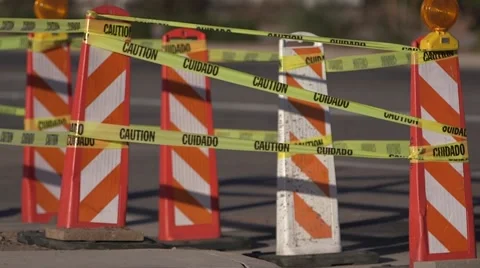 Road construction pylons with caution tape, cars pass by 02 Video stock 45515721