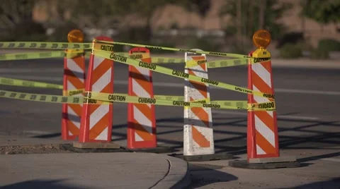 Road construction pylons with caution tape, cars pass by 03 Stock Footage 45515725
