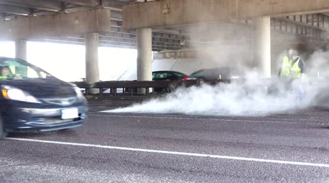 Road Construction, raking and rolling , steam and traffic Stock Footage 48196891