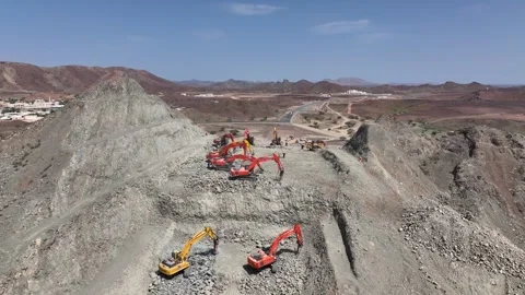 Road construction site Aerial view with excavator in Oman Stock Footage 325430160