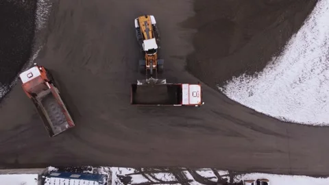 Road construction site with excavators and driving tippers Stock Footage 166576381