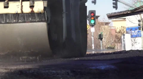 Road Construction, steaming asphalt on road Stock Footage 45667194
