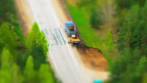 Road construction, tilt shift effect, trucks and excavator, road work, street Stock-Footage 307514394