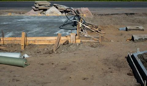 Road Construction Using Concrete and Metal in Summer Stock Photos
