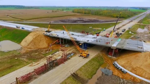 Road construction. View from above bridge construction over car highway Stock Footage 78636613